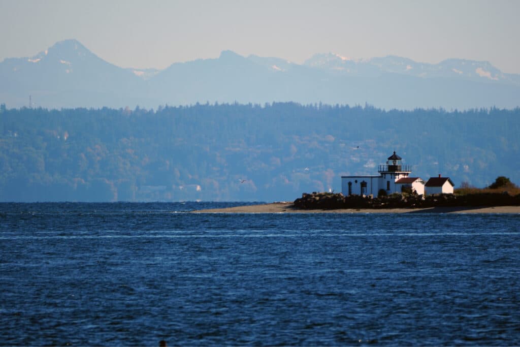 Point No Point lighthouse in Hansville with Puget Sound and the Cascades behind